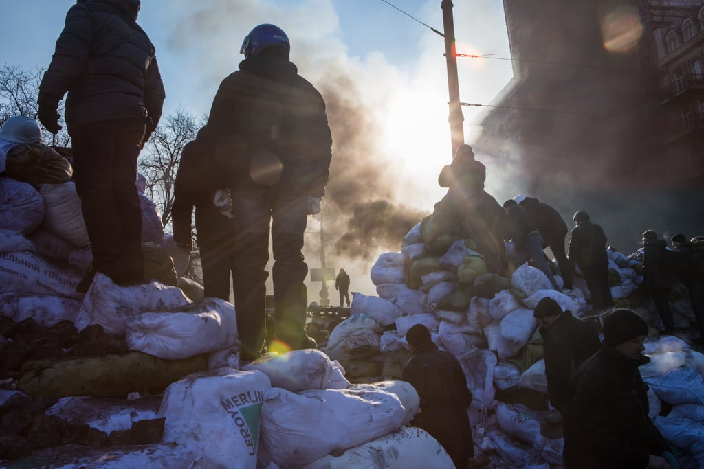 Protesters stood along the camp's barricade.