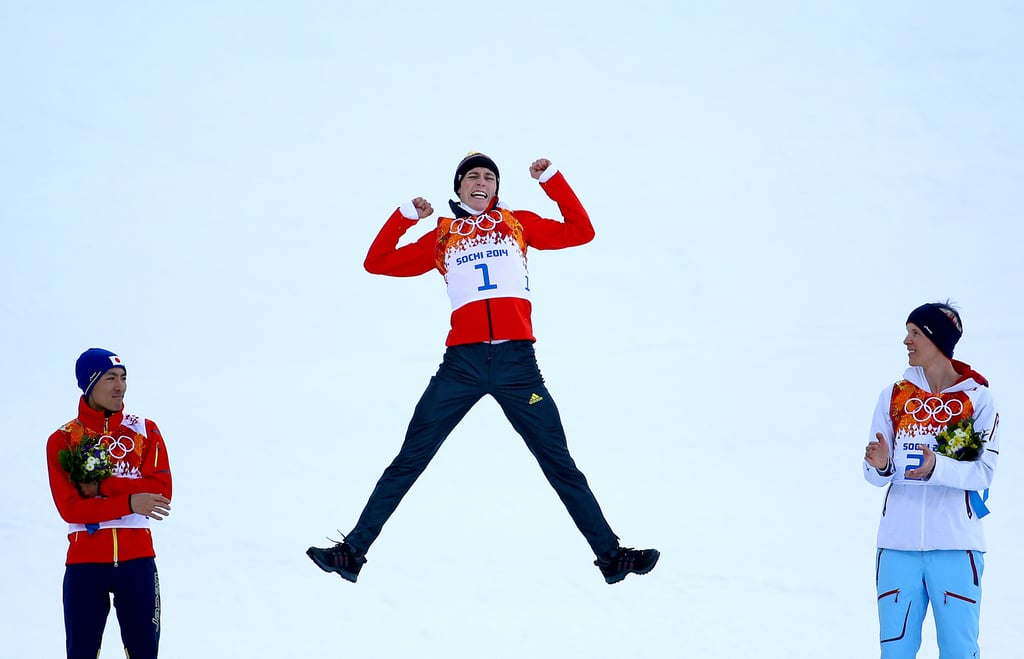Gold medalist Eric Frenzel of Germany jumped up to celebrate after winning the nordic combined cross-country event.