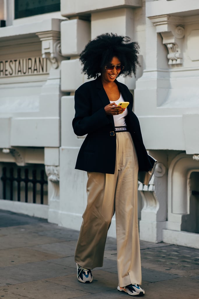 Swap your jeans out for trousers that elongate the leg and look great with a blazer — yes, you can totally wear your sneakers.