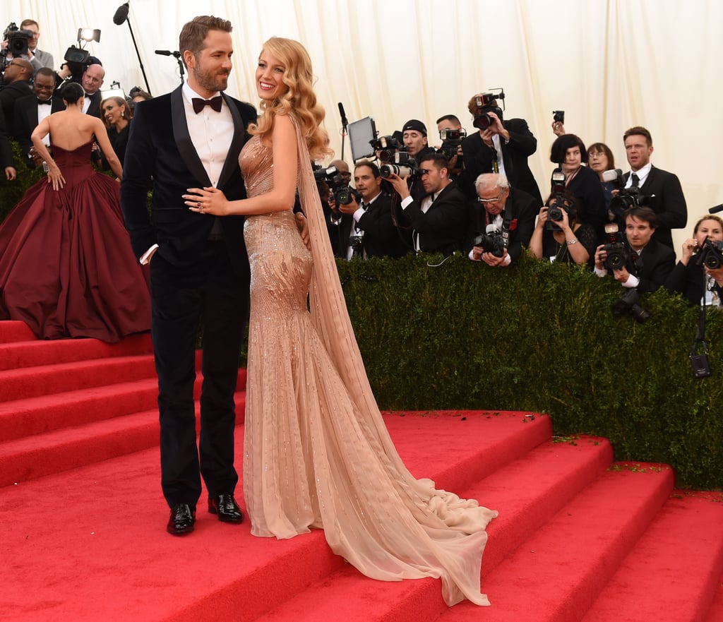 Ryan Reynolds and Blake Lively stopped on a landing.