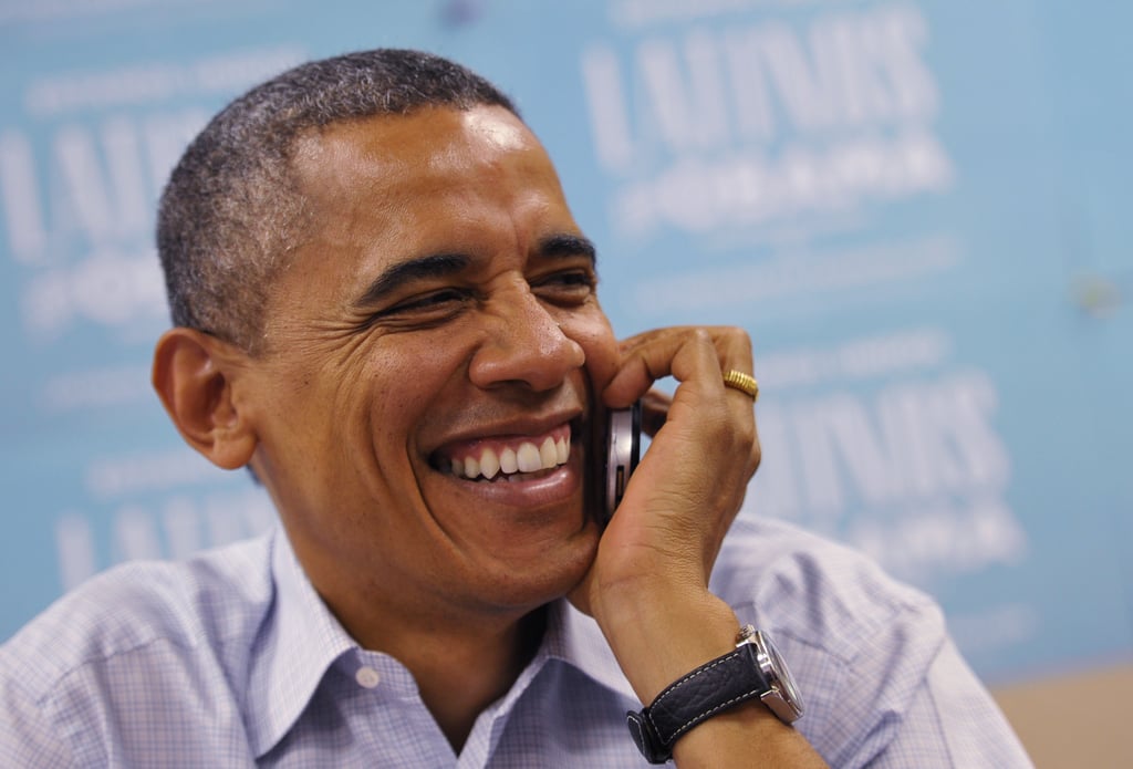 Chatting on the phone during a campaign call bank stop in 2012.