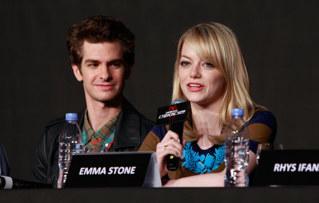 Andrew watched adoringly as Emma spoke at The Amazing Spider-Man press conference in South Korea in June 2012.