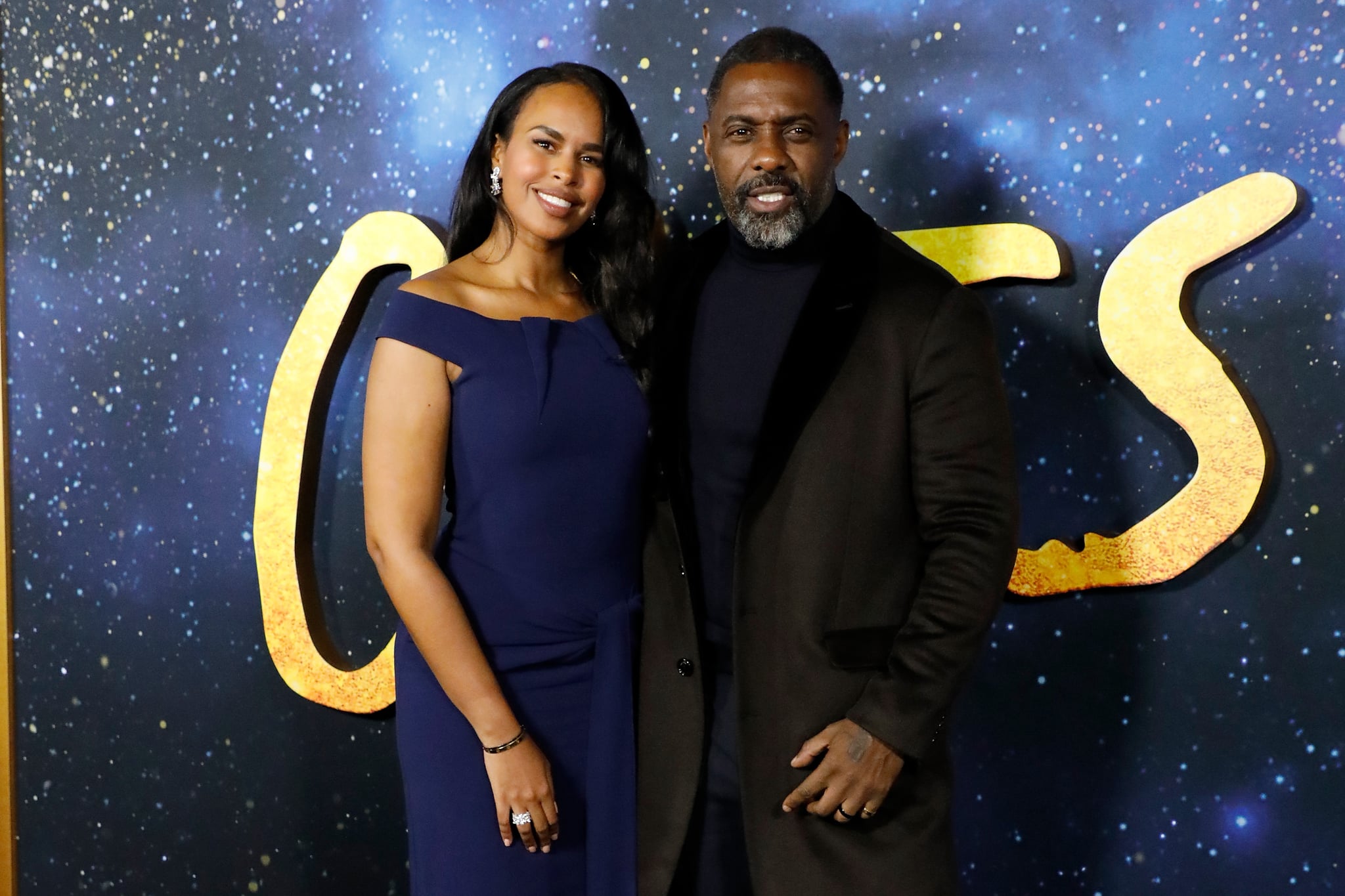 NEW YORK, NEW YORK - DECEMBER 16: Sabrina Dhowre and Idris Elba attend the world premiere of 