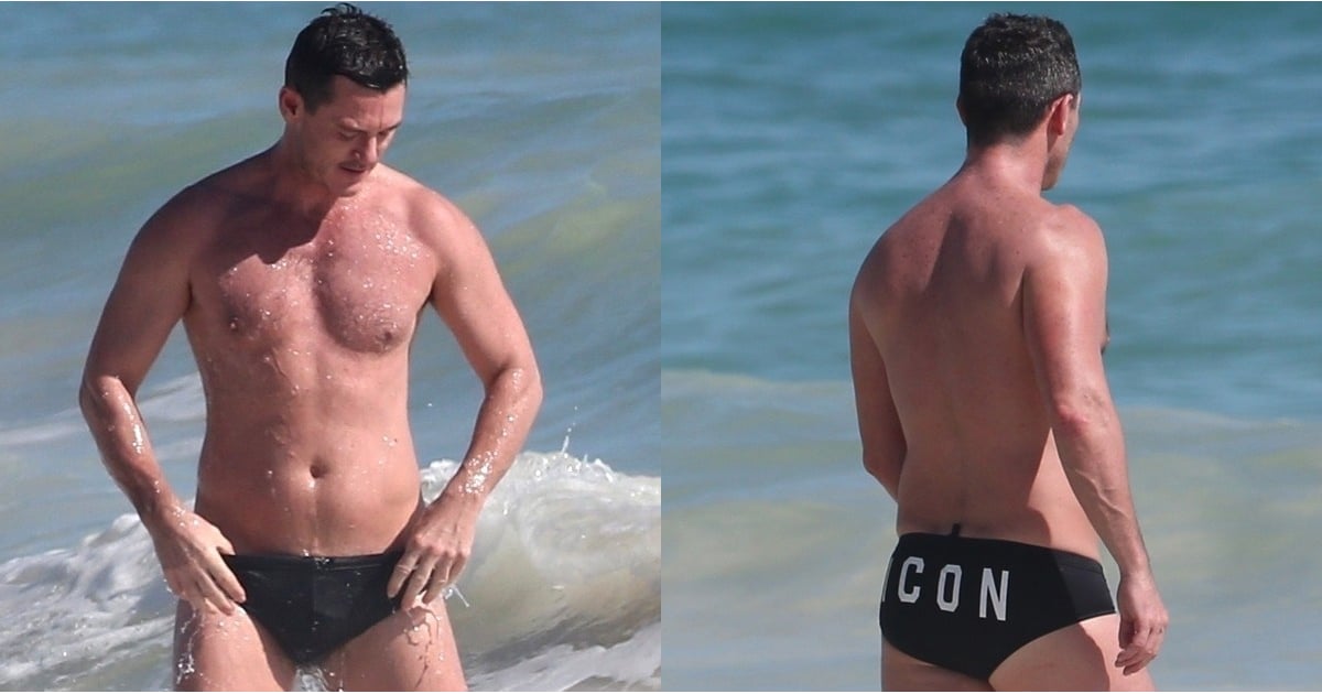 Luke Evans Hits the Beach in a Tiny Speedo, and Pardon Us, We Just Need a M...
