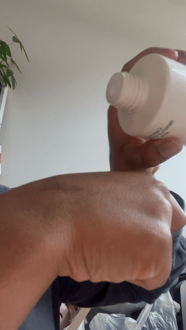 Using the Eadem Cashmere Peel Gentle Exfoliating AHA Toner on the back of the hand.