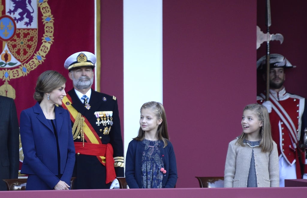 Queen Letizia shared a moment with her daughters during the National Day Military Parade in October.