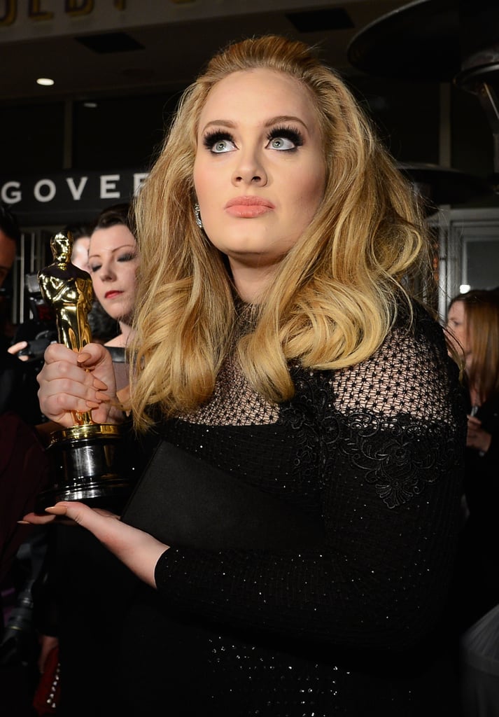 Adele held up her Oscar at the Governors Ball.
Adele held up her Oscar at the Governors Ball.
