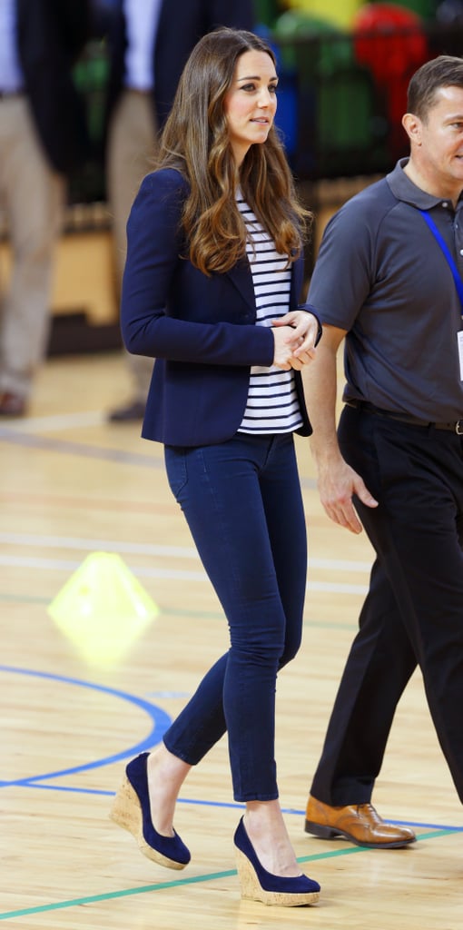 Kate went all-out in a navy-blue look, but broke up her separates with a striped tee.