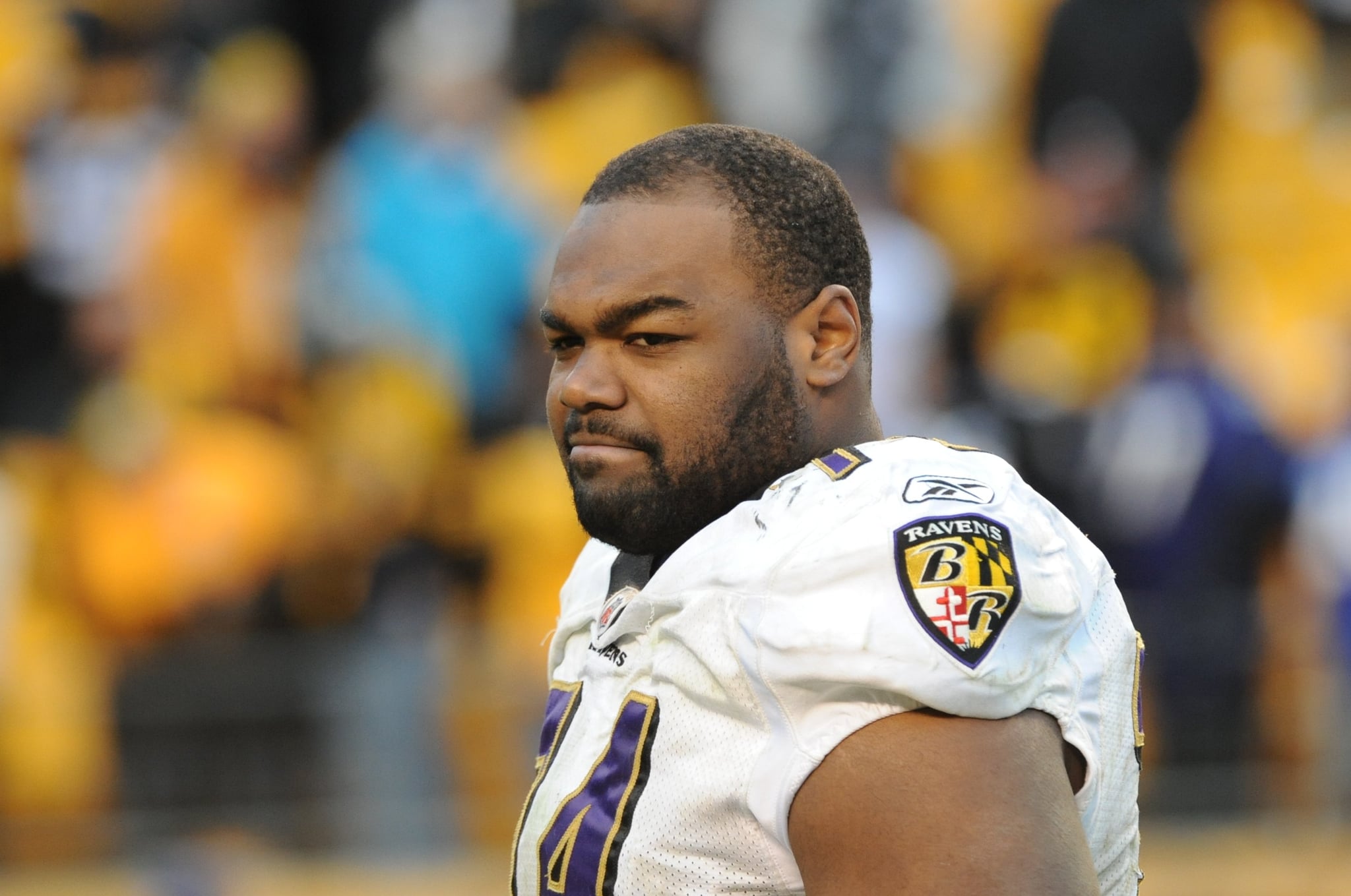 PITTSBURGH - DECEMBER 27:  Offencive lineman Michael Oher #74 of the Baltimore Ravens looks on from the field after a game against the Pittsburgh Steelers at Heinz Field on December 27, 2009 in Pittsburgh, Pennsylvania.  The Steelers defeated the Ravens 23-20.  (Photo by George Gojkovich/Getty Images)