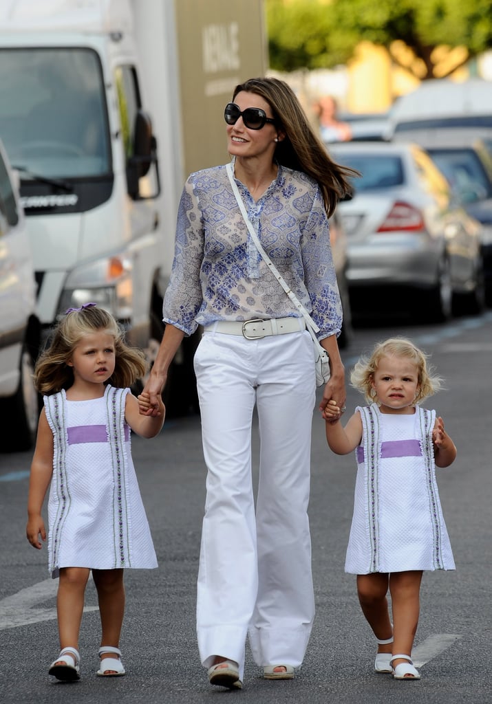 She walked hand in hand with her daughters during the sailing cup in August 2009.