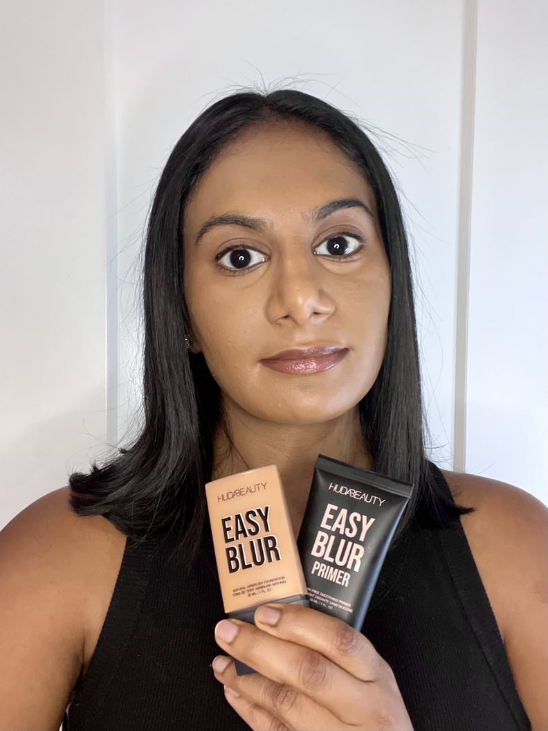 Woman using the Huda Beauty Easy Blur Foundation and Easy Blur Primer.
