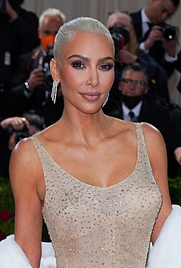 Watch Kim Kardashian Struggle to Climb Stairs in Tight Dress