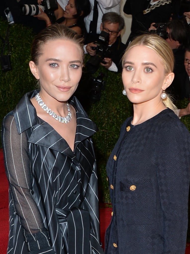 At the 2014 Met Gala, Mary Kate slicked her hair back into a loose bun while Ashley pulled hers back into a low ponytail.