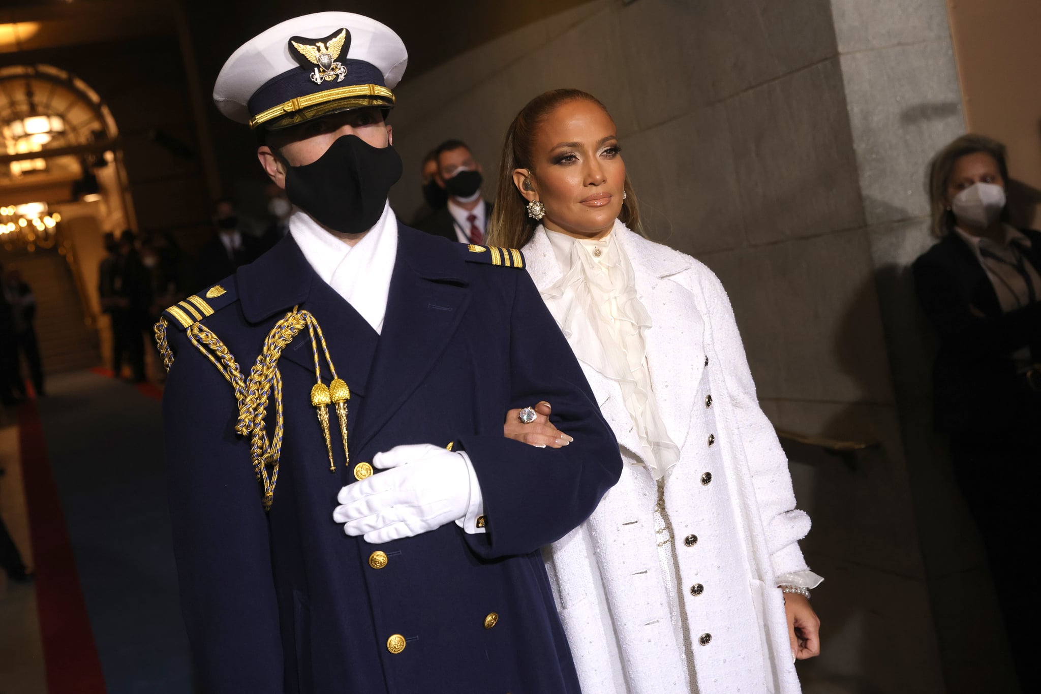 WASHINGTON, DC - JANUARY 20: Jennifer Lopez is escorted to  the inauguration of U.S. President-elect Joe Biden on the West Front of the U.S. Capitol on January 20, 2021 in Washington, DC.  During today's inauguration ceremony Joe Biden becomes the 46th president of the United States. (Photo by Win McNamee/Getty Images)