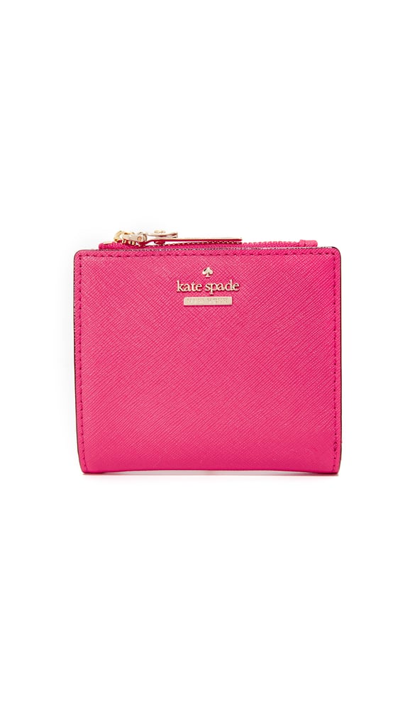Kate Spade New York Adalyn Small Wallet ($88)
True, this beautiful wallet isn't cheap, but knowing it'll last you a while, is it a splurge or an investment? This snappy little number comes in a few different colors, but we figured a bright pink would infuse the last dreary days of Winter with a pop of joy.