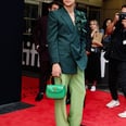 Harry Styles Pairs His Green Suit With a Floral Brooch and Matching Handbag