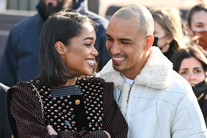 PARIS, FRANCE - MARCH 07:  Laura Harrier and Sam Jarou attend the Louis Vuitton Womenswear Fall/Winter 2022/2023 show as part of Paris Fashion Week on March 07, 2022 in Paris, France. (Photo by Stephane Cardinale - Corbis/Corbis via Getty Images)