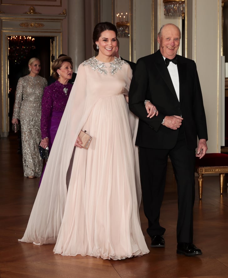 For the official dinner at the Royal Palace in Oslo on Feb. 2018, Kate walked down in this stunning Alexander McQueen cape creation. To finish her royal ensemble, Kate wore a pair of the queen's sparkling pendant earrings along with the queen's bracelet, which was a wedding gift from Prince Philip.