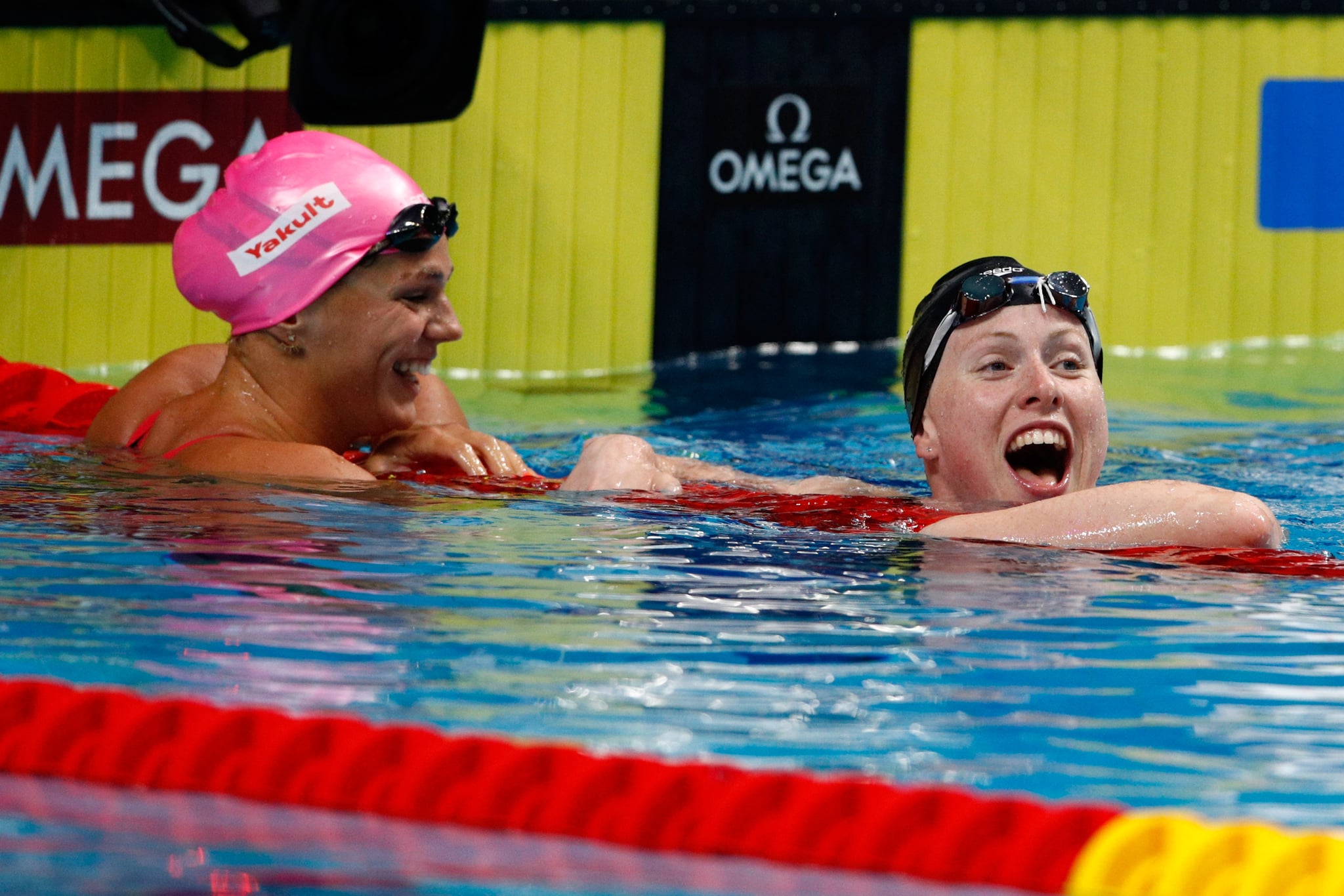 BUDAPEST, HUNGARY - JULY 30:  Lilly King of the United States (R) celebrates victory and a new World Record of 29.40 in the Women's 50m Breastsroke Final on day seventeen of the Budapest 2017 FINA World Championships on July 30, 2017 in Budapest, Hungary.  (Photo by Adam Pretty/Getty Images)