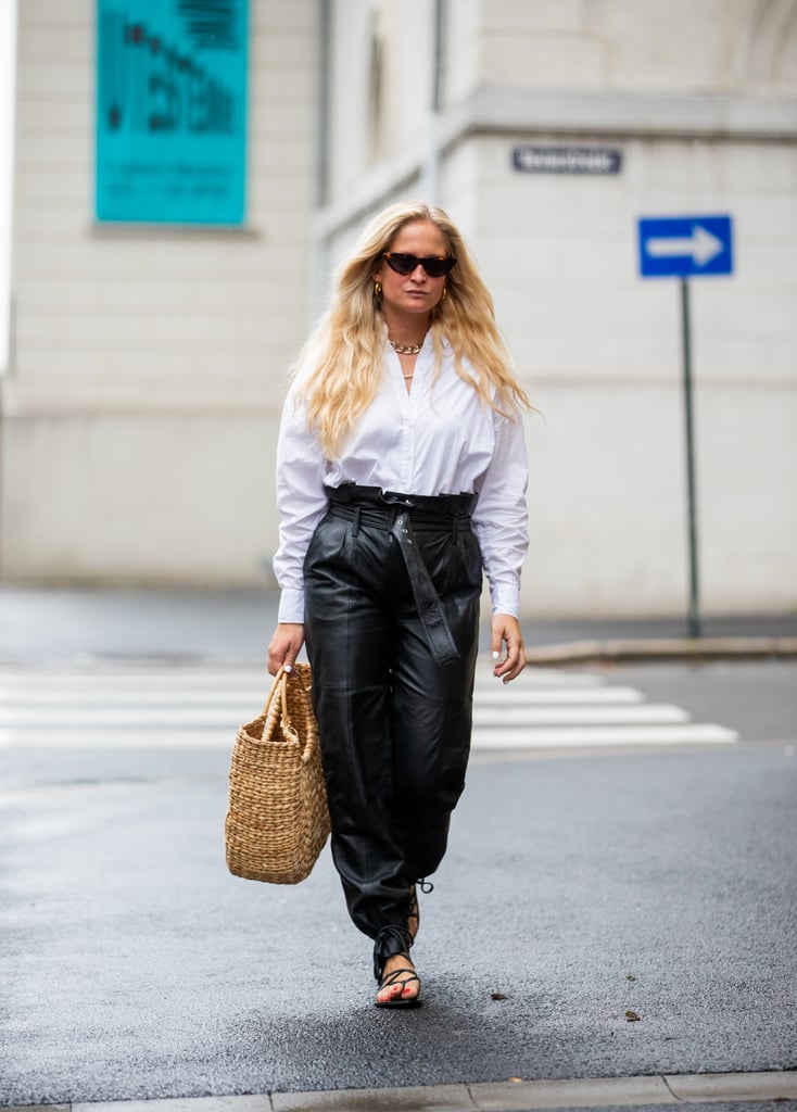 Free Photo  Cropped stock photo of an unrecognizable woman in white shirt  and formal black straight trousers and black leather heels standing in the  street fashion model dresscode concept