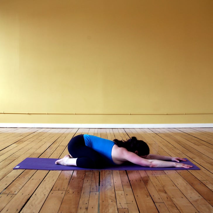 Wide Child's Pose Yoga After Cycling Class POPSUGAR Fitness Photo 12