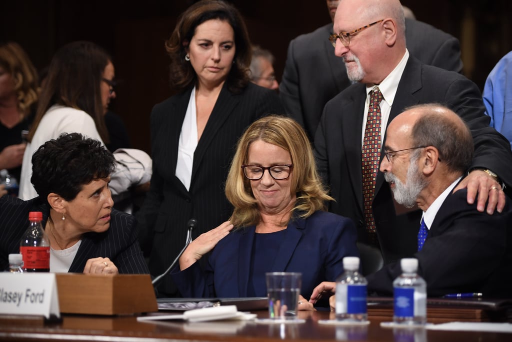 Ford is surrounded by her attorneys before testifying.