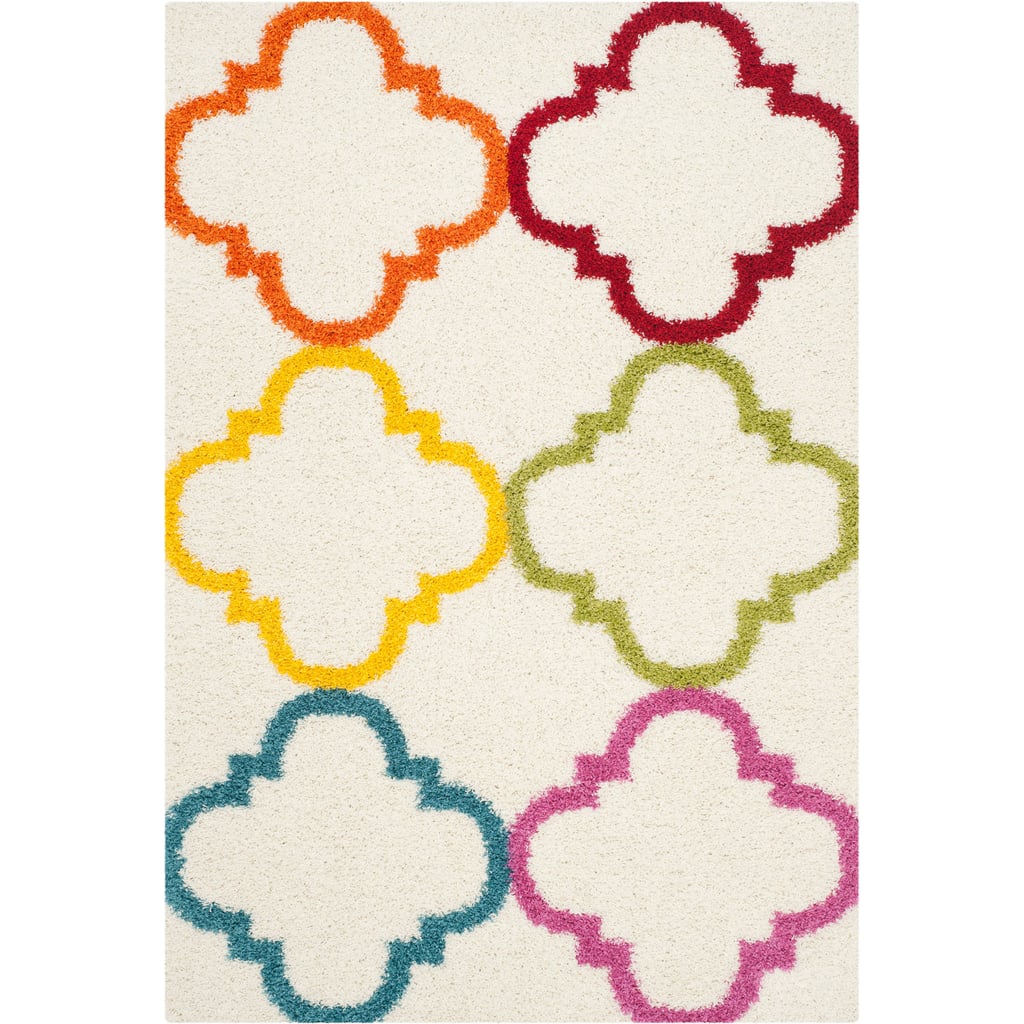 A playful take on an ultra-popular pattern, the Safavieh Kids Keeleigh Power-Loomed Shag Area Rug ($34-$184) puts repeating rainbow shapes on top of a neutral cream base.