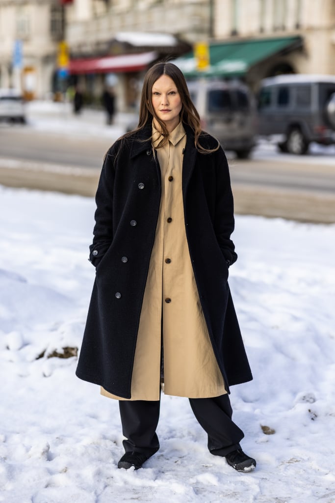 Wear one thicker, open coat over another of a slightly different length, fabric, and colour.