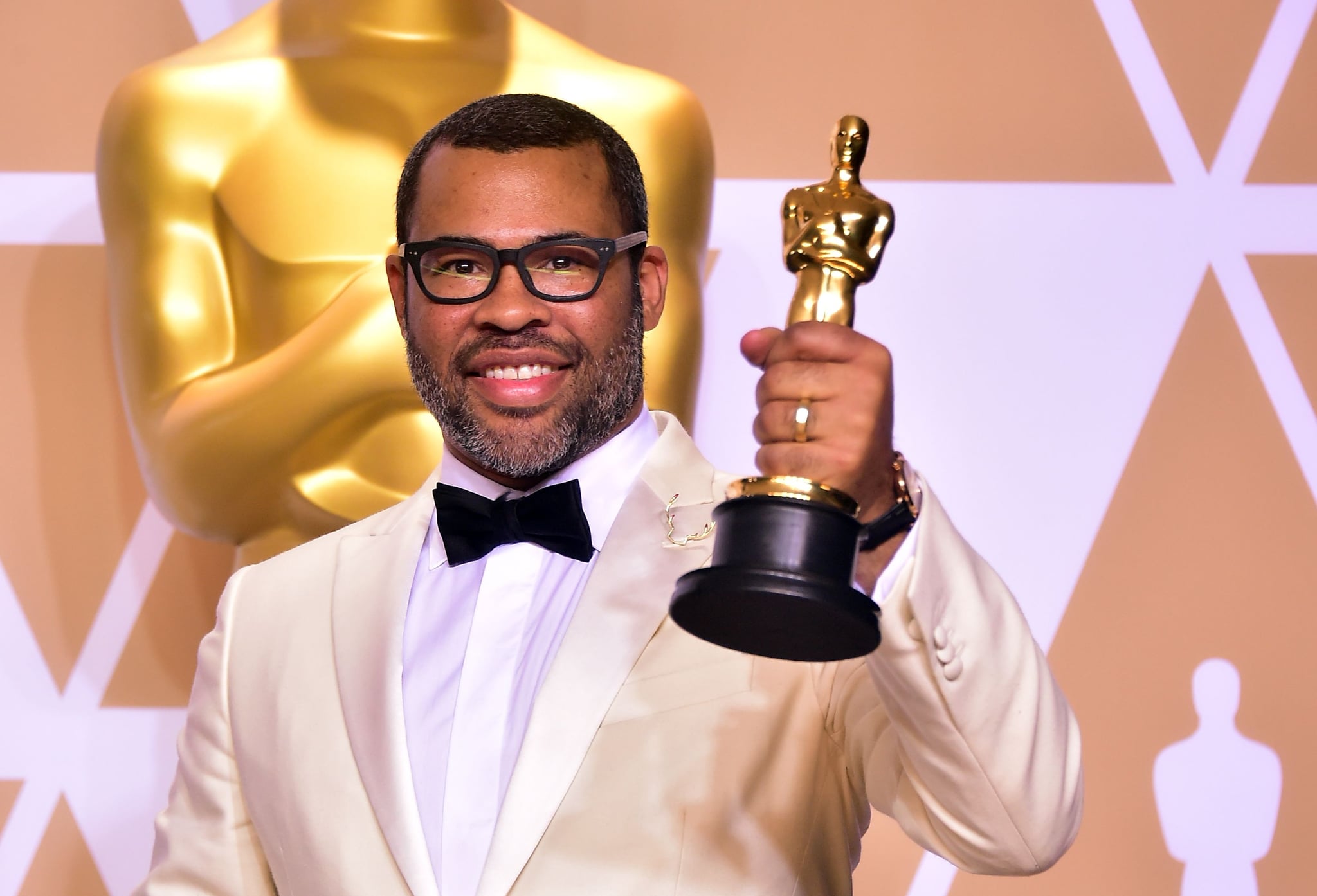 TOPSHOT - Director Jordan Peele poses in the press room with the Oscar for best original screenplay during the 90th Annual Academy Awards on March 4, 2018, in Hollywood, California.  / AFP PHOTO / FREDERIC J. BROWN        (Photo credit should read FREDERIC J. BROWN/AFP/Getty Images)