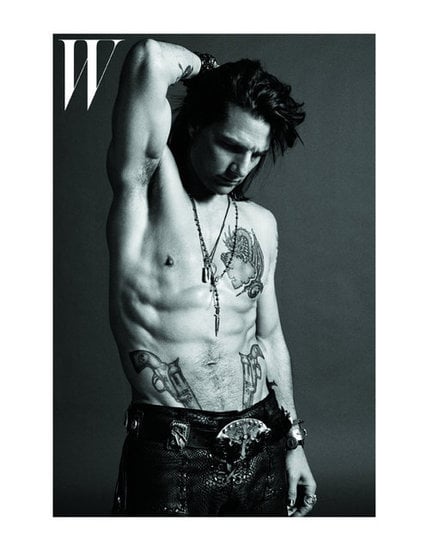 Tom Cruise posed shirtless on the cover of W magazine, showing off his spread of tattoos for Rock of Ages in June 2012.