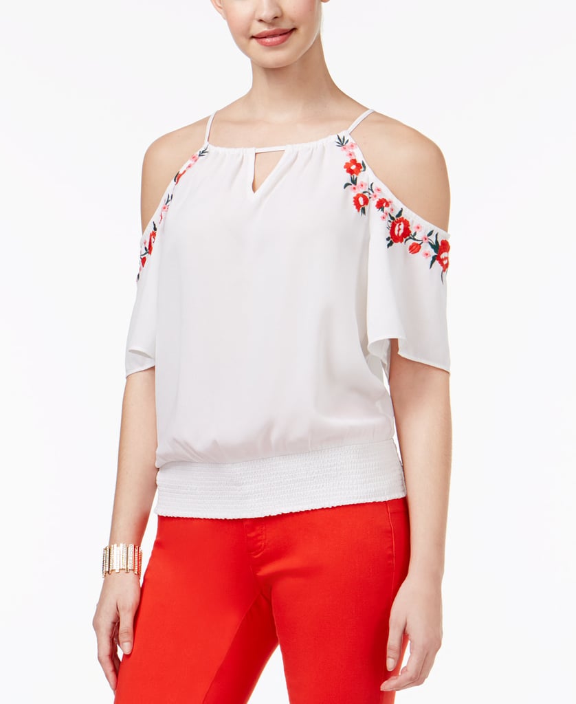 "Cold-shoulder tops are also still going strong. I love mixing that trend with other big ones, like ruffles and embroidery."
Thalia Sodi Embroidered Cold-Shoulder Top ($50, originally $60)