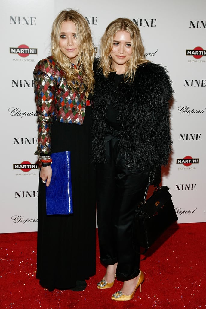 Twinning combo: Both girls wore eye-catching jackets and no-fuss beach waves for Nine's New York premiere in December 2009. 

Mary-Kate brought major spunk in a shimmering harlequin jacket and cobalt leather clutch.
Ashley proved all-black is anything but boring in a cropped feathered jacket, silk trousers, and slick leather gloves.