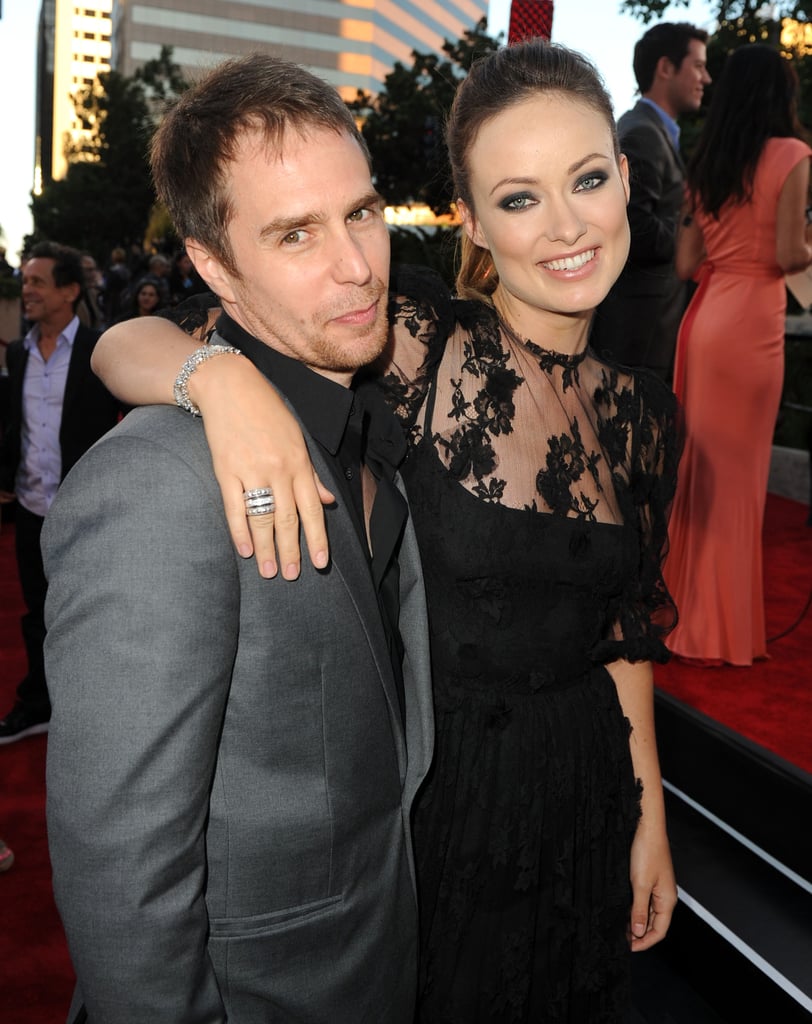 Olivia Wilde kept her arm around Sam Rockwell at the premiere of Cowboys & Aliens in 2011.