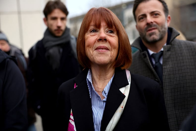 Gisele Pelicot (C) arrives with her lawyer Antoine Camus (R) at the courthouse in Avignon on December 19, 2024, as the verdict is expected in the trial of her ex-husband, with 50 others, accused of drugging her and orchestrating multiple rapes over nearly