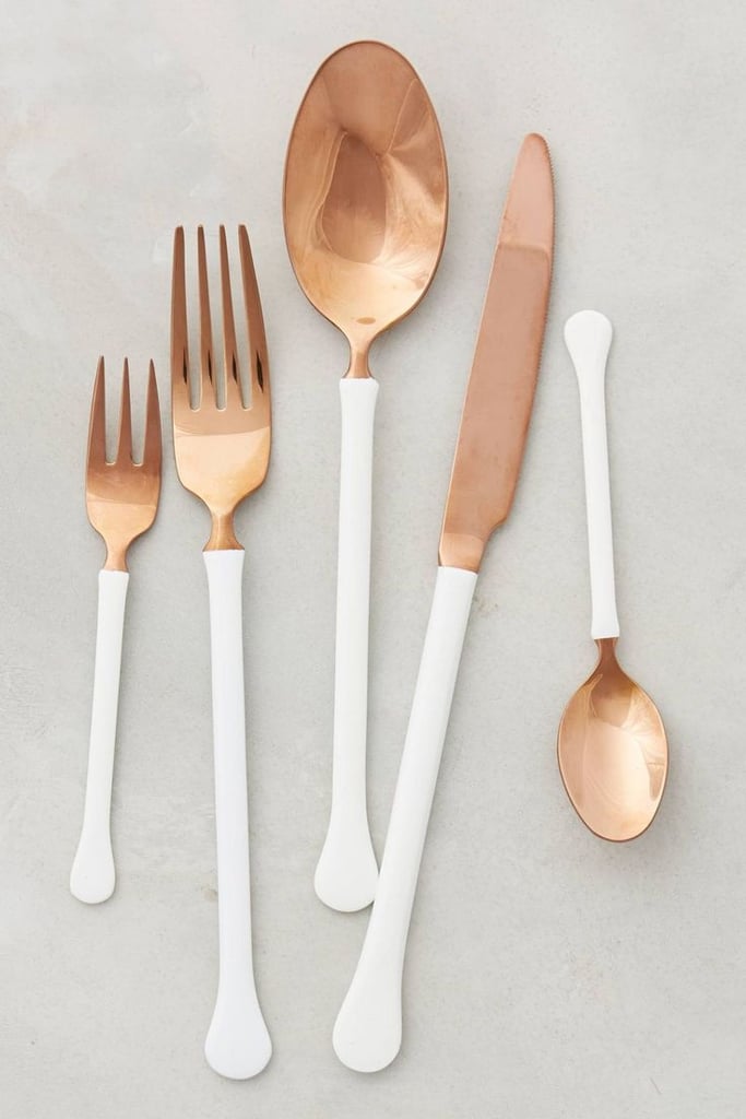 If you have a thing for gold flatware, you'll be just as enchanted by the warm glow of a copper place setting. Something about the rosy metal reminds me of old tea kettles and Julia Child's pots and pans. I love how this copper flatware set's ($78) white stems give it a modern pop. 
— Angela Elias, editor