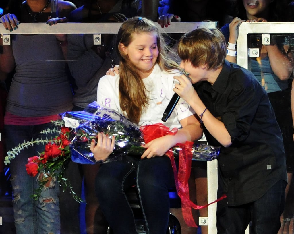 A young Justin Bieber sang to a fan on stage at the Pepsi Super Bowl Fan Jam in 2010.