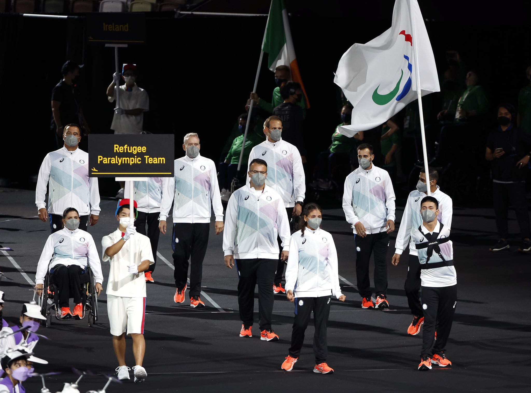 TOKYO, JAPAN - AUGUST 24: Members of the Refugee Paralympic Team participate in the parade of nations during the opening ceremony of the Tokyo 2020 Paralympic Games at the Olympic Stadium on August 24, 2021 in Tokyo, Japan. (Photo by Tasos Katopodis/Getty Images)