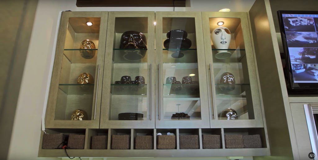 Some of her kitchen cabinets are more for decor than practicality, like this one featuring numerous sculptures.