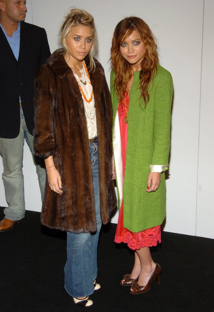 Twinning combo: During Spring 2005 New York Fashion Week, the Olsens proved the power of statement outerwear, bundling up in two noteworthy coats.

Mary-Kate played the color card, layering an apple-green coat over her punchy slip dress.

Ashley warmed up in a luxe, chocolate-colored fur and light-wash denim.