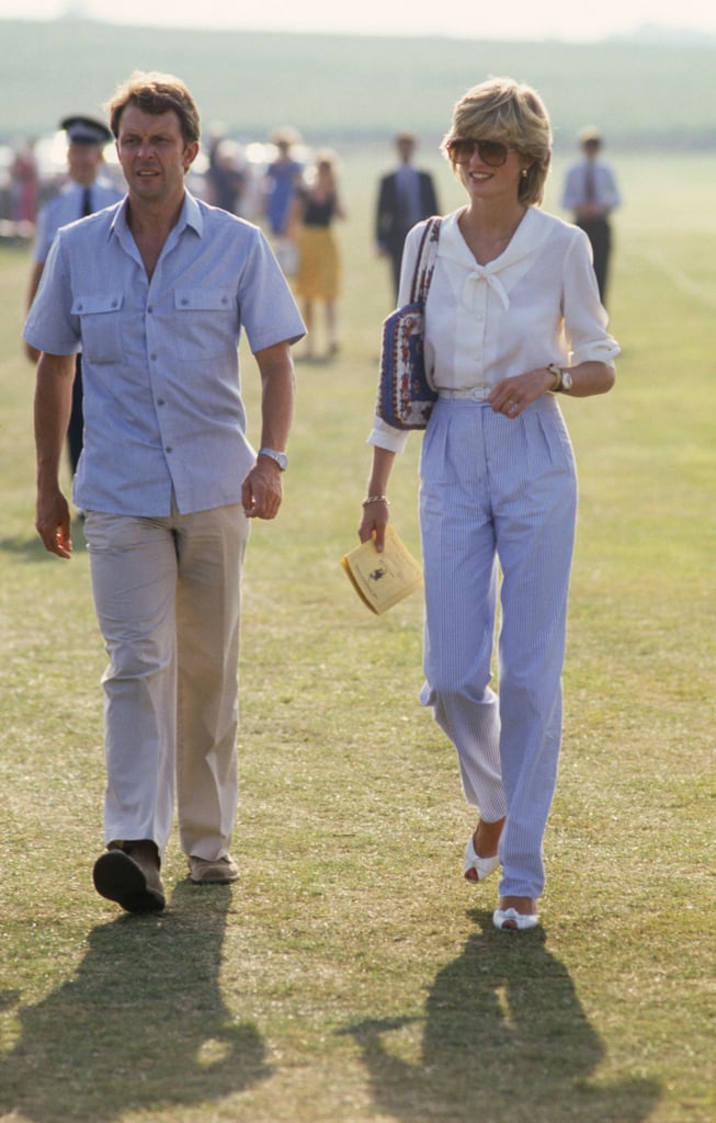 Attending a polo match, Diana paired her signature frames with a relaxed blouse and high-waisted trousers.