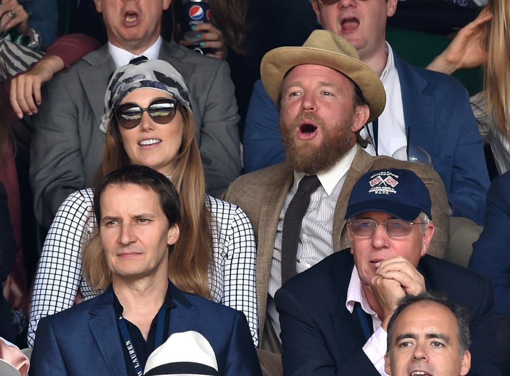 Guy Ritchie sported a beard as he watched a match with fiancée Jacqui Ainsley.