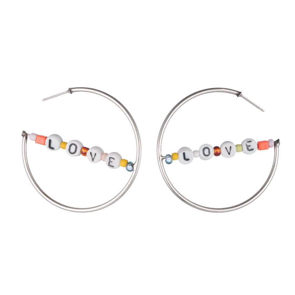 "Instead of wearing your heart on your sleeve, wear these AZIZ earrings by Dannijo ($145). The beads give your regular ol' hoops a fun upgrade and make just the statement you need. I'd rock the accessory with a plain white tee and frayed denim shorts." — Marina Liao