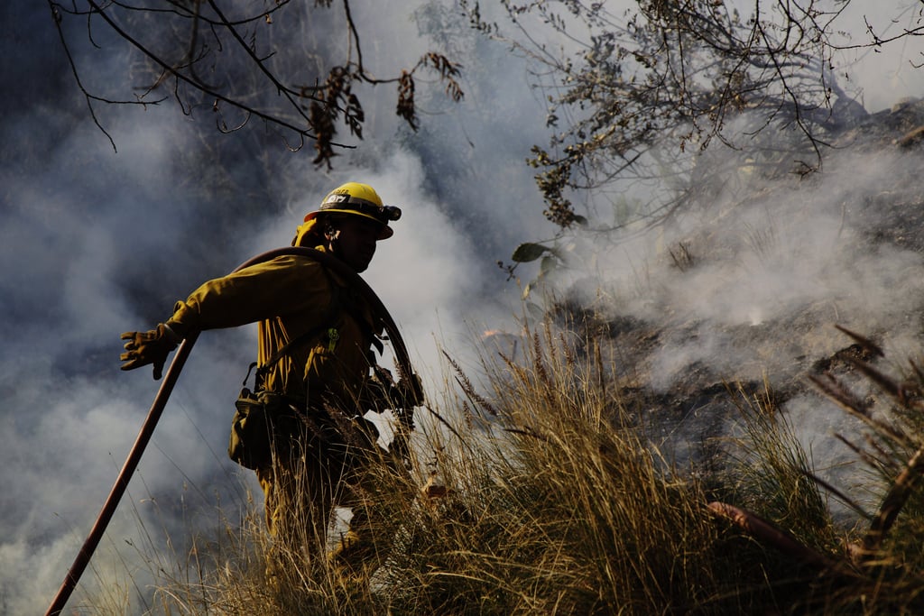 Firefighter Jason Mendoza worked to extinguish the flames in Glendora, CA.