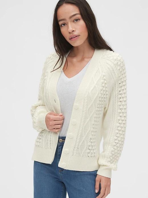 Whether you're layering a turtleneck top or t-shirt under your slip dress or bearing some skin, this Bobble-Stitch Raglan Cardigan Sweater ($98) is amazing to have on hand. It can be worn normally for additional warmth or off your shoulders for a look that's both casual and a little bit fancy.