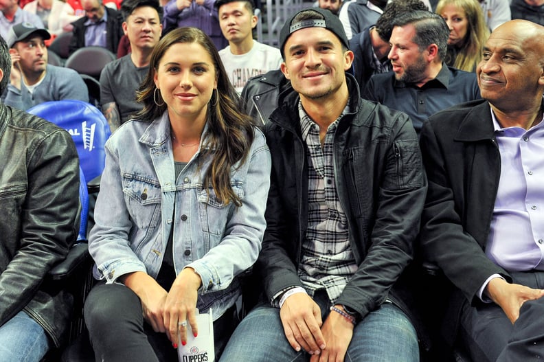 LOS ANGELES, CALIFORNIA - DECEMBER 17: Alex Morgan and Servando Carrasco attend a basketball game between the Los Angeles Clippers and the Phoenix Suns at Staples Center on December 17, 2019 in Los Angeles, California. (Photo by Allen Berezovsky/Getty Ima