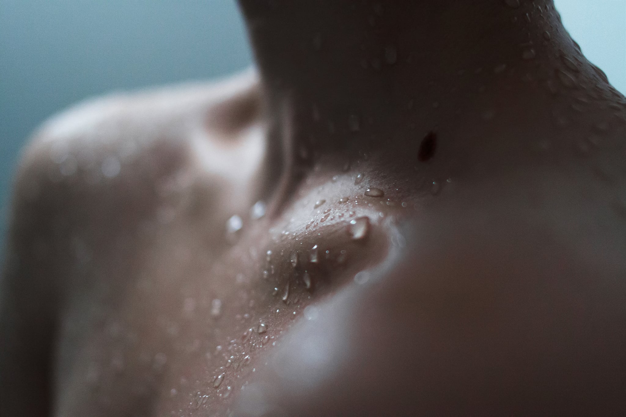 Portrait of young Caucasian woman enjoying a shower.