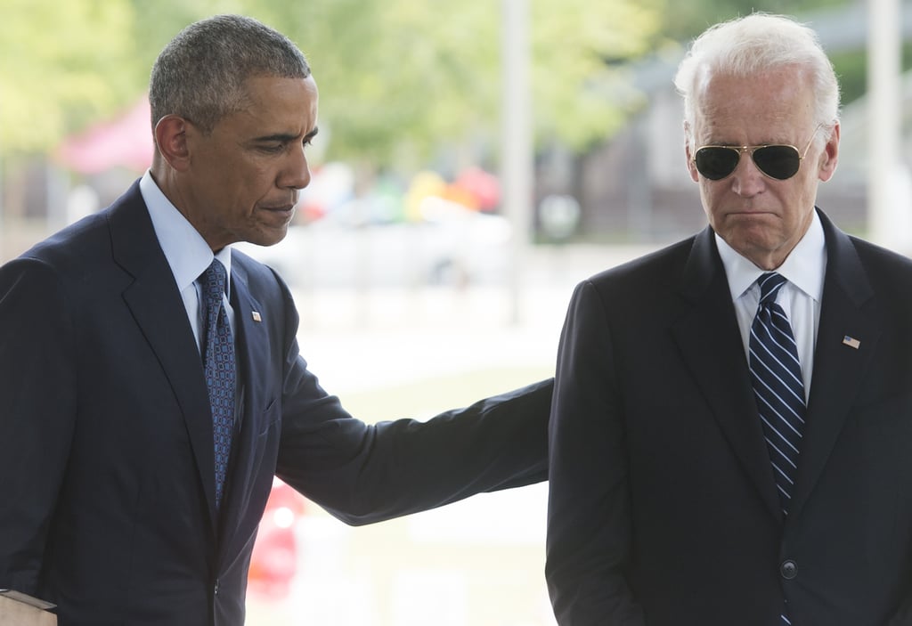 President Obama puts his arm on Vice President Biden during their visit to honor the victims of Orlando.