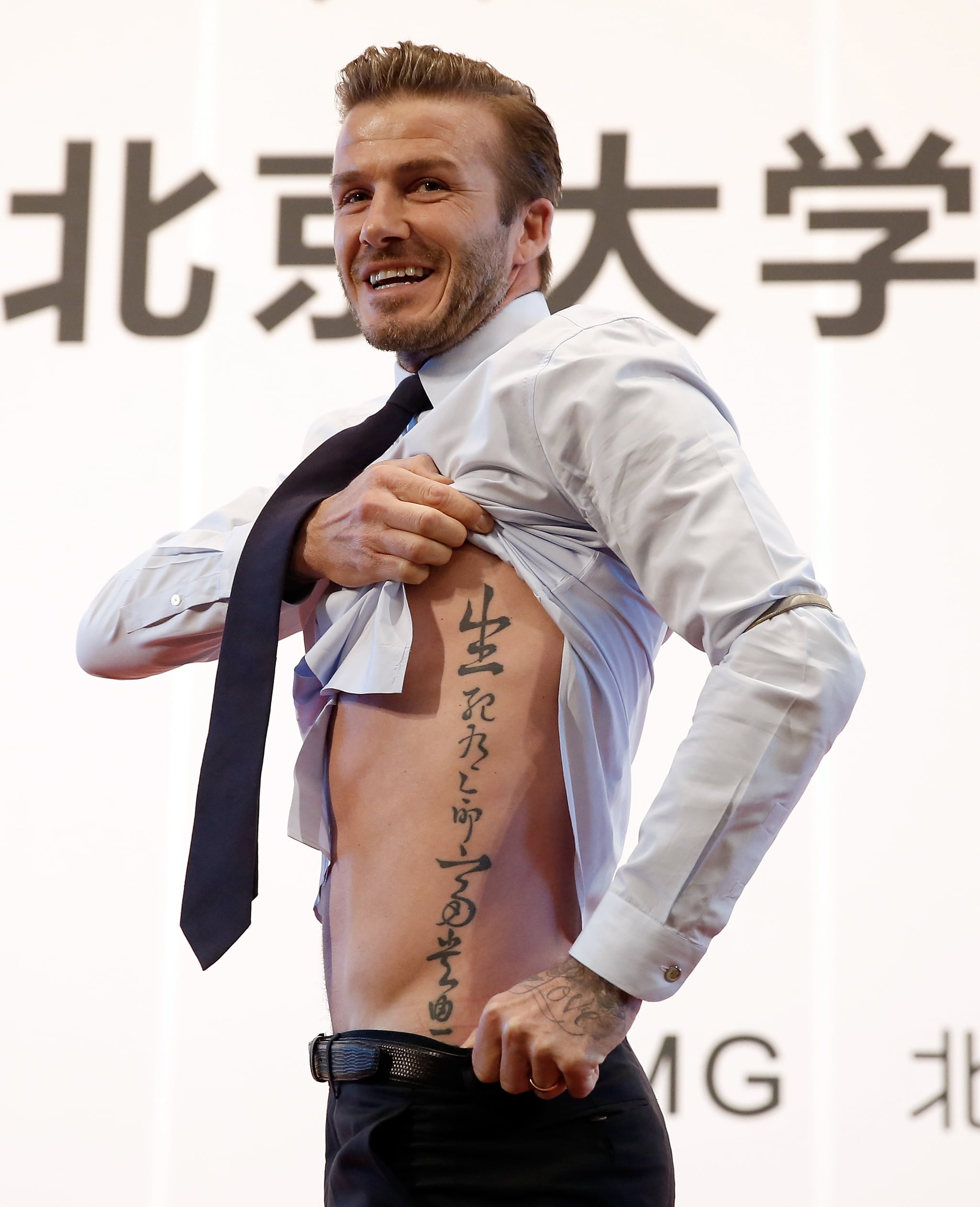 During a trip to Beijing, David showed off his Chinese proverb tattoo