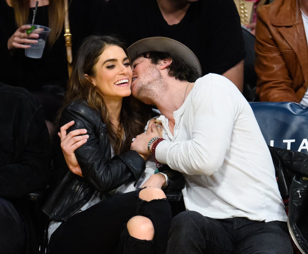 Ian gave Nikki a kiss during a basketball game in December 2014.