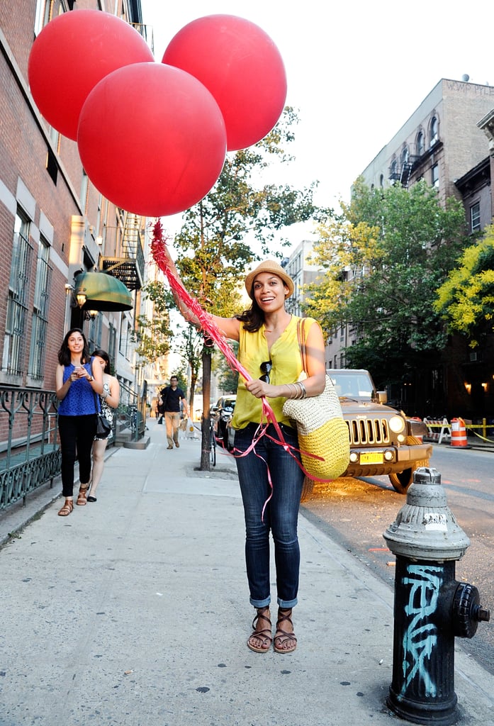 Rosario Dawson held some giant balloons in NYC on Thursday.